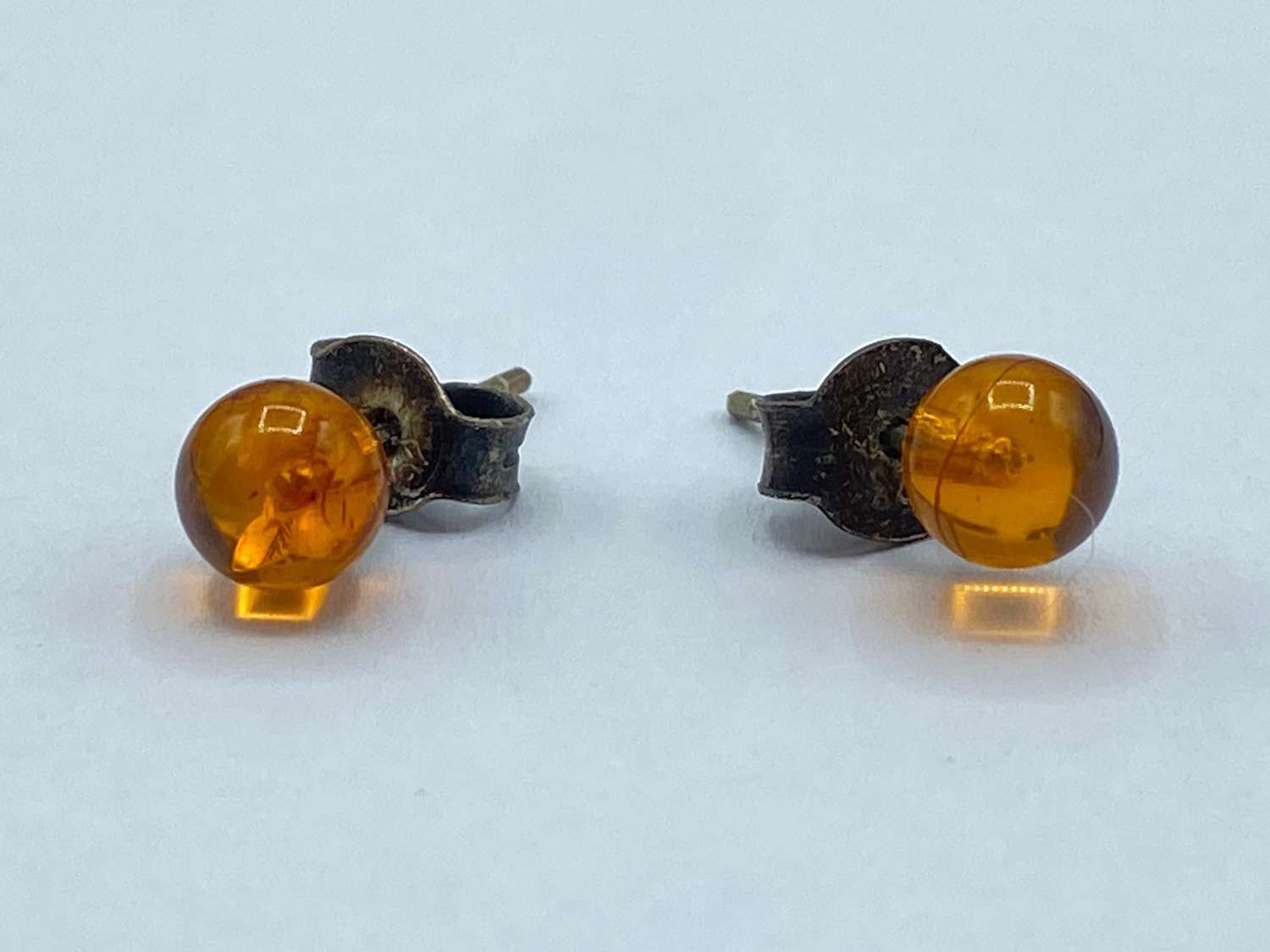 Pair of Antique Sterling Silver & Cabochon Baltic Amber Stud Earrings